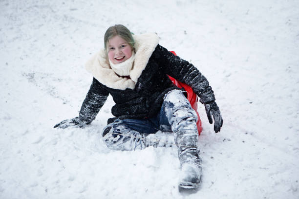 istock Young girl outside in the snow 1344042514