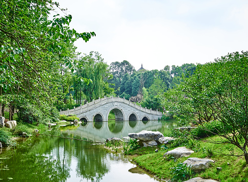 An arch bridge in a park in Chengdu, Sichuan, China