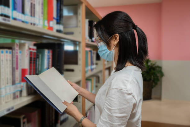 istock An Asian lady is reading carefully 1344046522