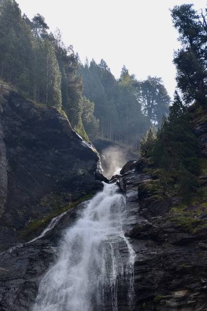 istock Beautiful huge waterfall between trees at national park 1344047561