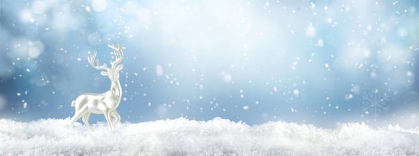 istock Christmas background with white decorative deer in snow. 1344048865