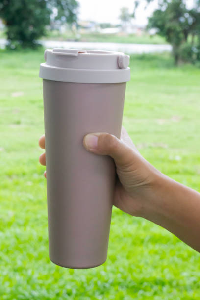 istock Hand on coffee stainles steel thermo cup 1344055505