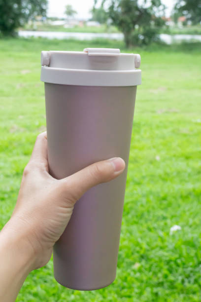 istock Hand on coffee stainles steel thermo cup 1344055506