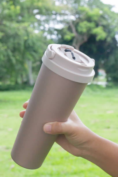 istock Hand on coffee stainles steel thermo cup 1344055639