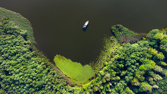 Houseboat on a small lake, water lily field, Mecklenburgische Seenplatte - aerial view