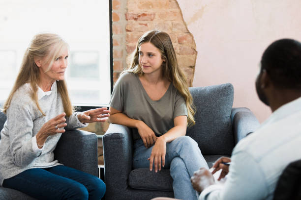 istock As her mom talks to therapist, daughter listens 1344060063