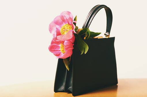 Small black leather bag with pink peony flowers