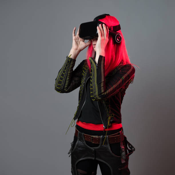 istock Stylish young gamer in a virtual reality helmet, playing in simulations, 1344075694