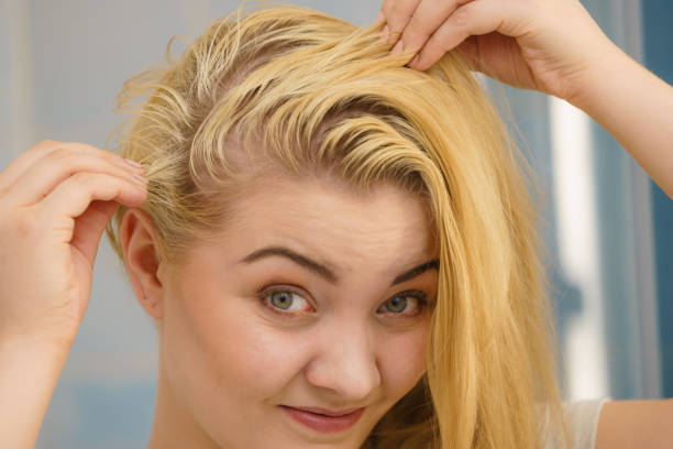 istock Female having problem with blonde hair 1344077730