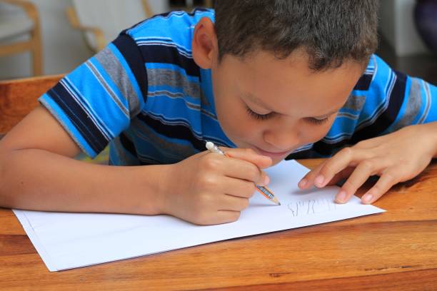 istock child at home doing school work stock photo 1344077852