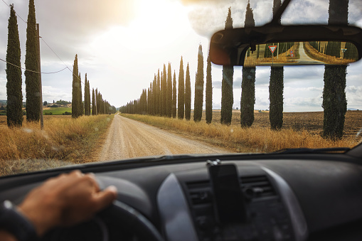 POV car driving: onboard camera on iconic Tuscany road