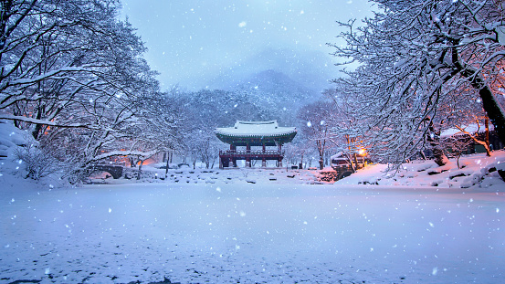 Baekyangsa Temple and falling snow, Naejangsan Mountain in winter, South Korea.