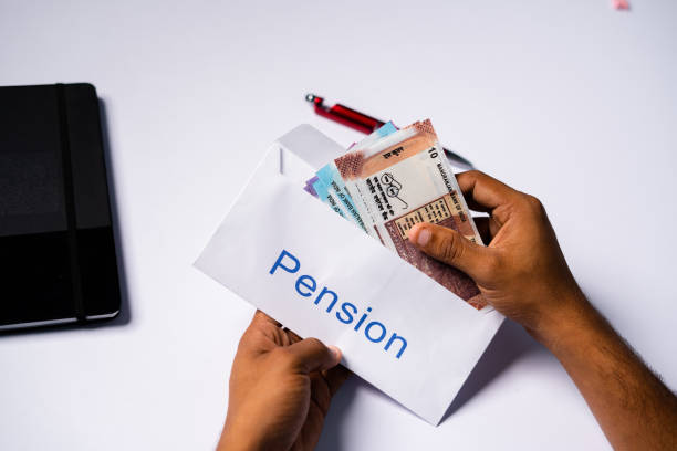 shoulder shot of man opening received pension money from envelope - concept of retirement pension payments and savings. - pension retirement benefits perks imagens e fotografias de stock