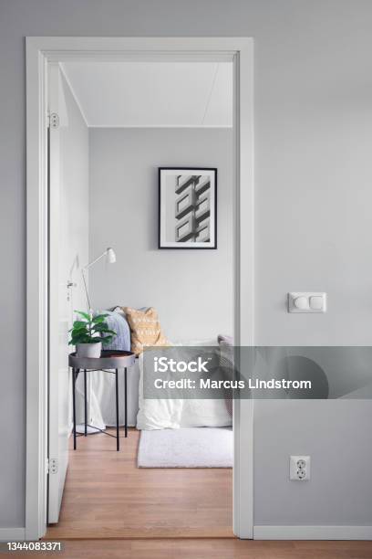 View Into A Modern Guest Room Through A Doorway Stock Photo - Download Image Now - Bedroom, Doorway, Small