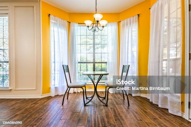Breakfast Nook With Bay Windows In A Texas House Stock Photo - Download Image Now - Kitchen, Yellow, Wall - Building Feature