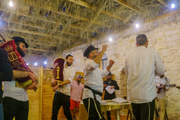 Simchat Torah tradition, in Safed (Tzfat) Safed, Israel - September 28, 2021: Prayers carrying the Torah scrolls (hakafot, circuits), part of Simchat Torah tradition, in Safed (Tzfat), Israel simchat torah photos stock pictures, royalty-free photos & images