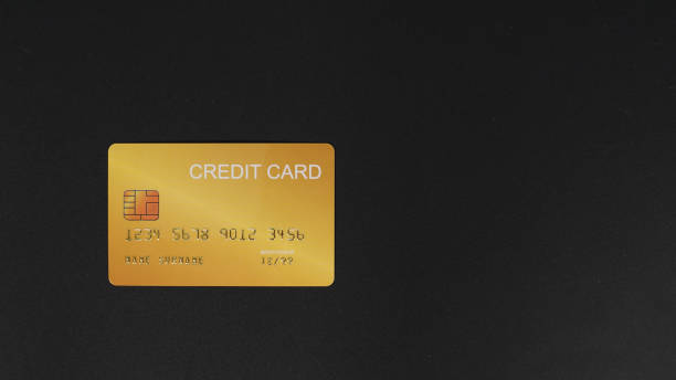 istock Gold credit card isolated on black background. 1344086871