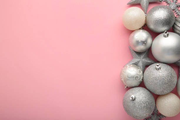 istock Christmas decoration with Christmas silver balls on pink background 1344090342
