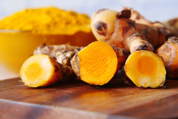 istock detail shot of turmeric root in bowl on table , 1344091149