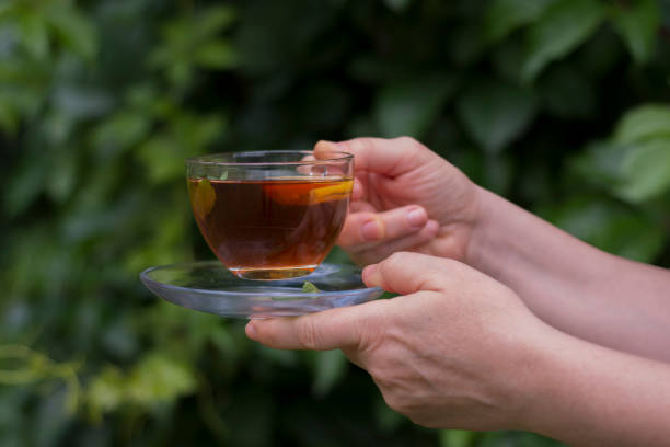 istock Young woman in glasses is drinking oolong tea 1344091444