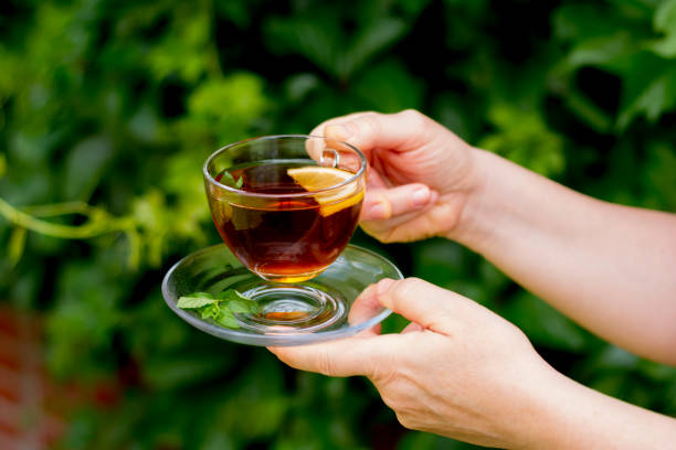 istock Young woman in glasses is drinking oolong tea 1344091498