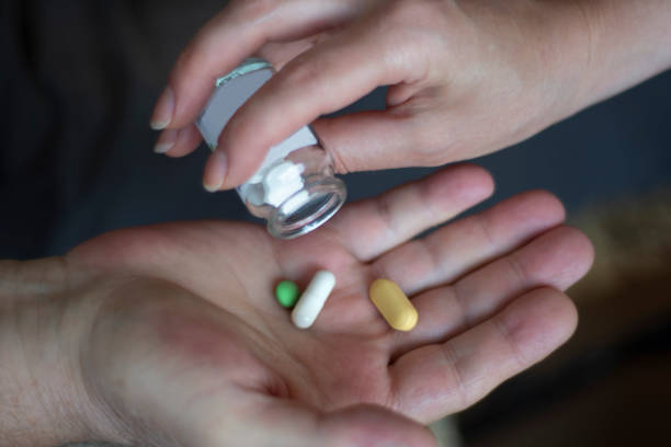 istock doctor giving medicine to old man 1344091736