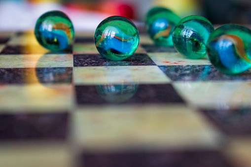 Deep glass balls on a chessboard