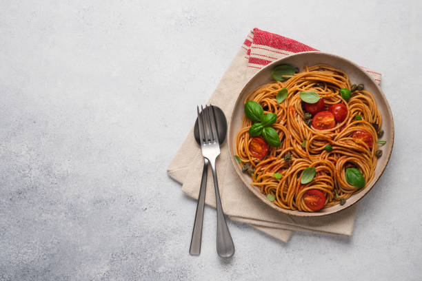 istock Whole wheat pasta with tomato sauce 1344093375