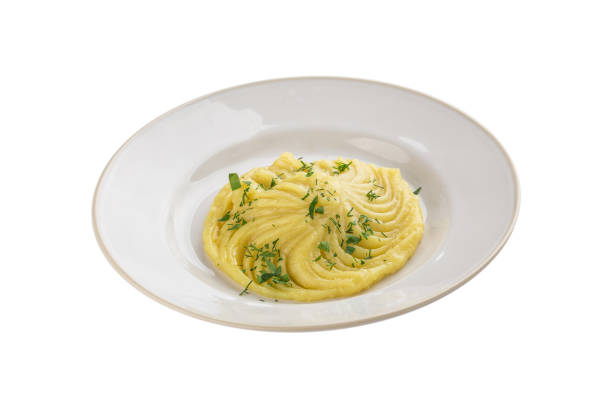 istock Mashed potato with dill on white plate isolated on white background 1344095715