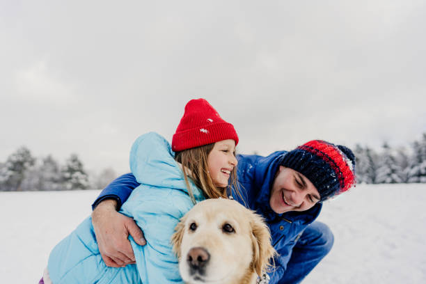 istock On snow with our dog 1344095956