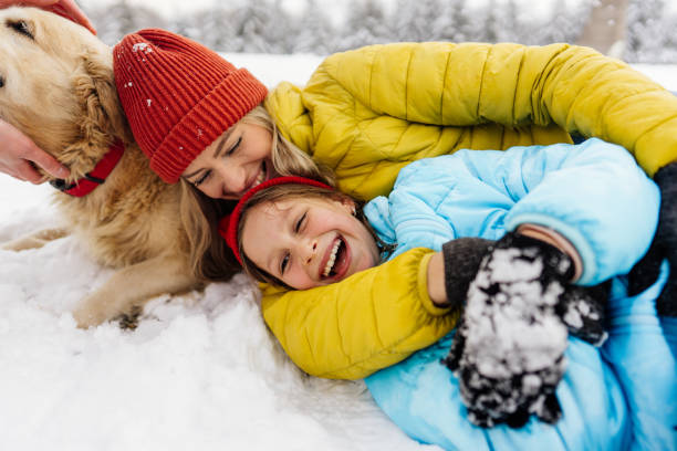 istock On snow with our dog 1344096602