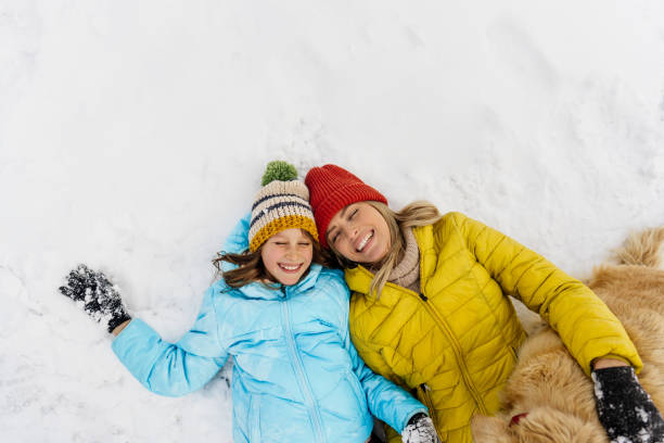 istock On snow with our dog 1344096654