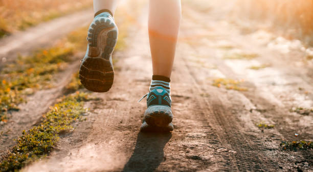istock Young girl is running at sunset. 1344099868