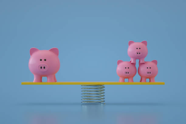 istock Piggy Bank on Balance Board 1344102551