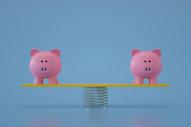 istock Piggy Bank on Balance Board 1344102631