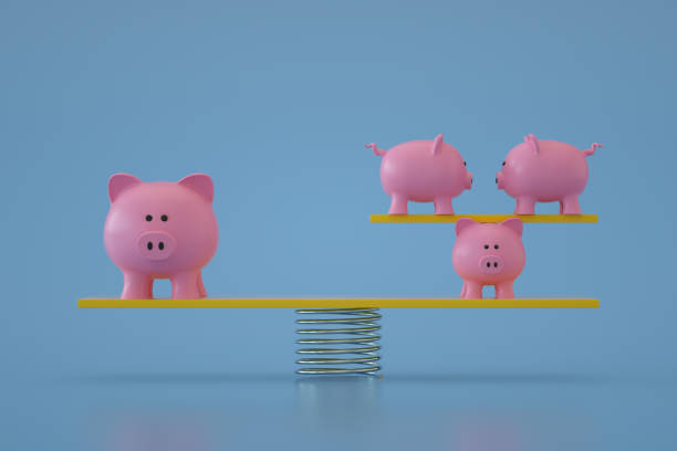 istock Piggy Bank on Balance Board 1344102747