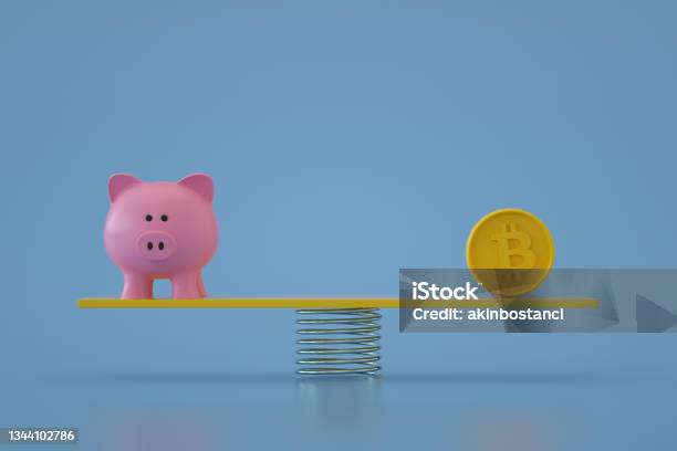 Piggy Bank With Bitcoin On Balance Board Stock Photo - Download Image Now - Bitcoin, Seesaw, Coin
