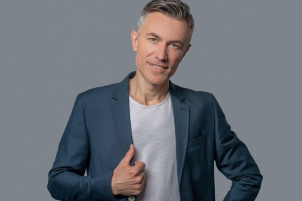 istock Attractive mature man in gray jacket 1344102862