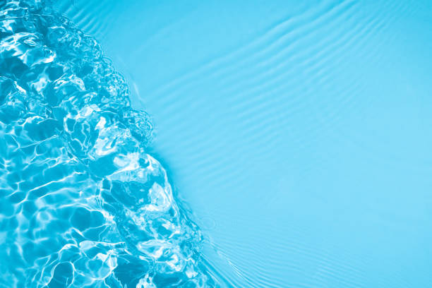 istock transparent blue colored clear calm water surface texture 1344103770