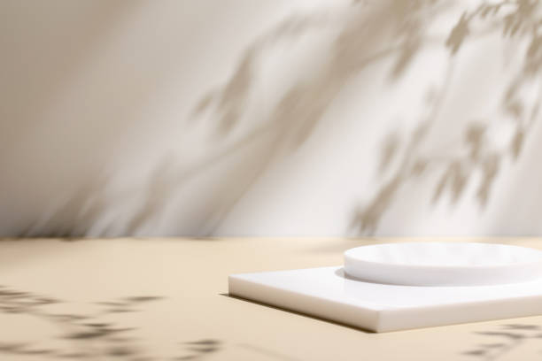 istock scene with white podium on beige background and shadows 1344103847