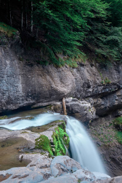 istock Waterfall with silk effect on the water in a beautiful natural site 1344105921