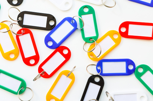 Lots of colorful keychains with a place to sign top view