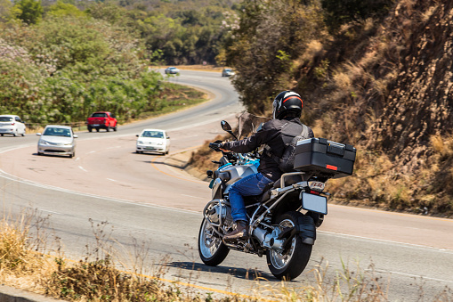 BMW 1200gs motorcycle travelling through the Magaliesburg mountains in South Africa