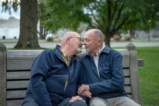 beso de pareja gay mayor - gay man homosexual men kissing fotografías e imágenes de stock