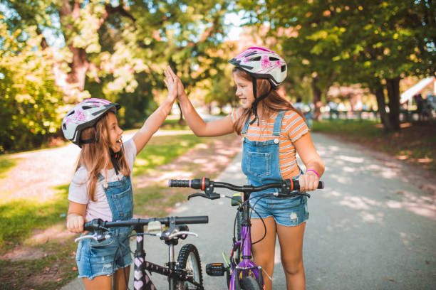 istock Happy kids love to ride bikes 1344109057