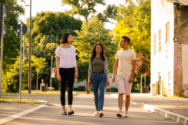 istock Front view of three young friends going for a relaxing walk 1344109800