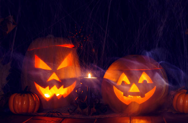 istock Halloween. Two Jack Lanterns with the attributes of holiday 1344111552