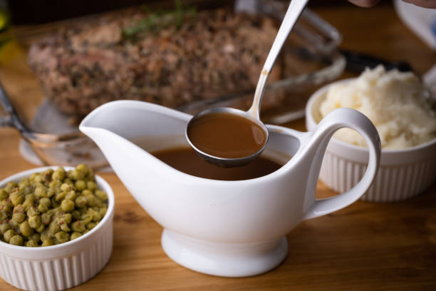 istock gravy sauce in sauce pod with mashed potato 1344114258