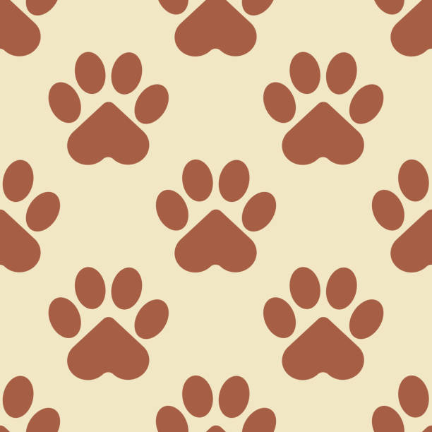 istock Paw of a brown cat, puppy or bear on a beige background. Seamless patterns for modern textiles and fabrics, wrapping paper, decorative pillows. Vector. 1344118596