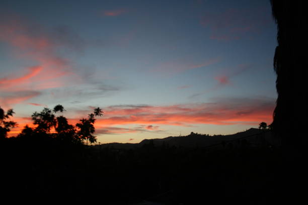 istock Pink Clouds in Blue Sky - Hollywood Skyline 1344118756